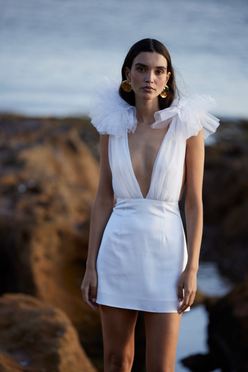 dramatic white mini dress IRREPLACEABLE RUFFLE SLEEVE TULIP HEM MINI DRESS IN WHITE